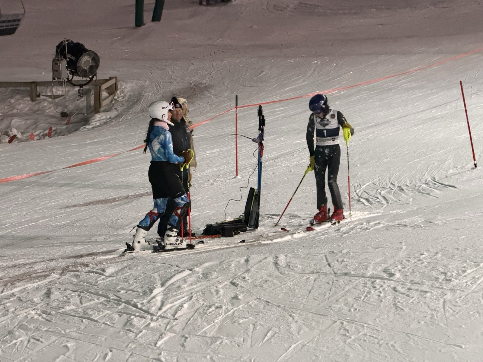 Alpine Program racers at the start under the lights during night training